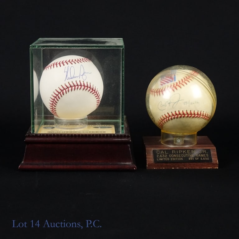 Nolan Ryan & Cal Ripken Jr. Signed Baseballs: Two baseballs, one signed by Nolan Ryan and the other signed by Cal Ripken, Jr. The Nolan Ryan baseball is am Official Major League (Bud Selig) ball and was signed with a blue ballpoint pen. This ball
