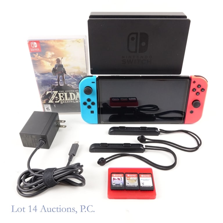 Nintendo Switch OLED with Games (4): Nintendo Switch OLED with 2 Joy-Cons, base, power adapter and Joy-Con straps. Tested and Working. Lot also includes 4 games: "The Legend of Zelda Breath of the Wild" (in original case); "Star Wars The