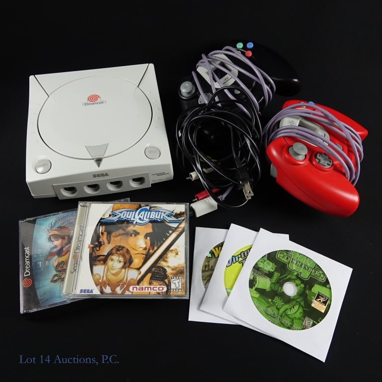 Sega Dreamcast Console & Games (5): Sega Dreamcast console with cables, 2 aftermarket controllers and 5 games: Shenmue; Soul Calibur; Wacky Races (in paper sleeve); Virtua Tennis (in paper sleeve) and Toy Commander (in paper sleeve).