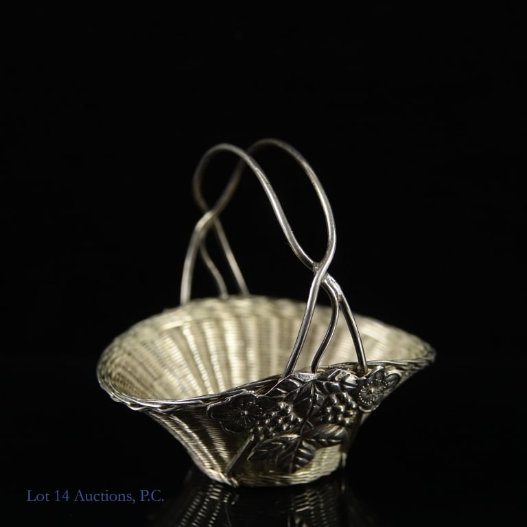 Chinese Export Silver Wire Basket (c. 1900): Chinese export silver wire basket. Circa 1900. Woven basket with applied relief molded fruiting grapes. signed underneath. 2.5" tall. Weight: 24.75 grams.