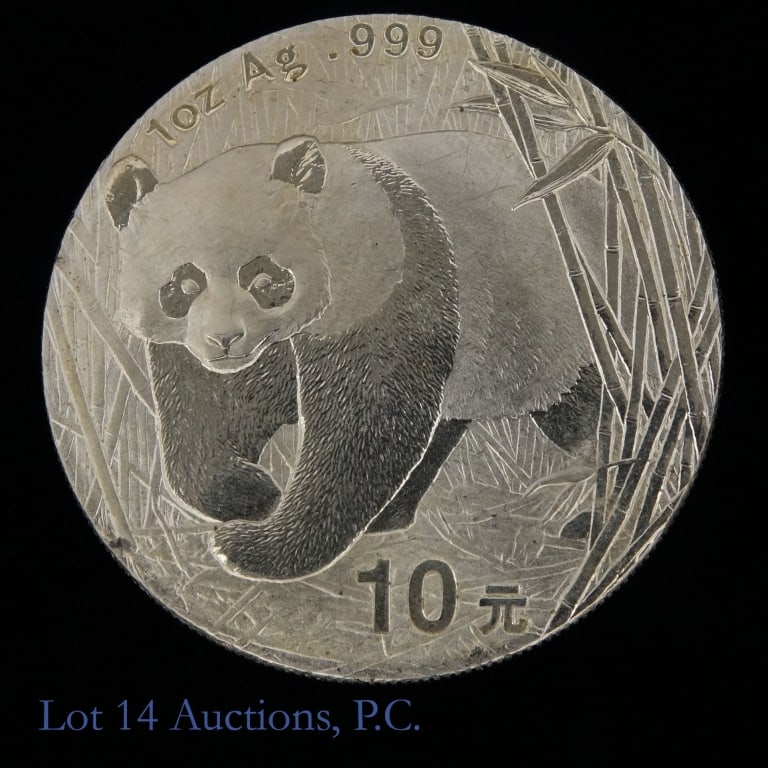 2001 China 99.9%-Sliver 1 Ozt. 10 Yuan Panda Coin: 2001 China 99.9%-silver bullion 10 yuan coin. Metal is 99.9% silver, weighs 31.1 grams and diameter 40 mm. Mintage 250,000. *** Lot 14 Auctions is not a professional numismatic grading agency. Consign