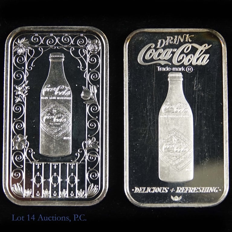 Silver 1 Ozt. Coca-Cola 75th Ann. Ingots (2): Two (2) silver Coca-Cola 75th anniversary ingots Metal is 99.9% silver and weighs one troy ounce each as follows: ---1976 Coca-Cola Norfolk, Virginia (s/n 002219); and ---1977 Coca-Cola Mobile, Alabam