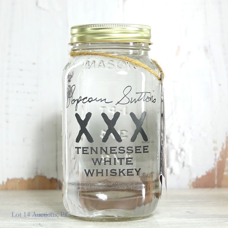 Popcorn Sutton's XXX TN White Whiskey: Popcorn Sutton's XXX Tennessee white whiskey. 93 proof. 750 ml.