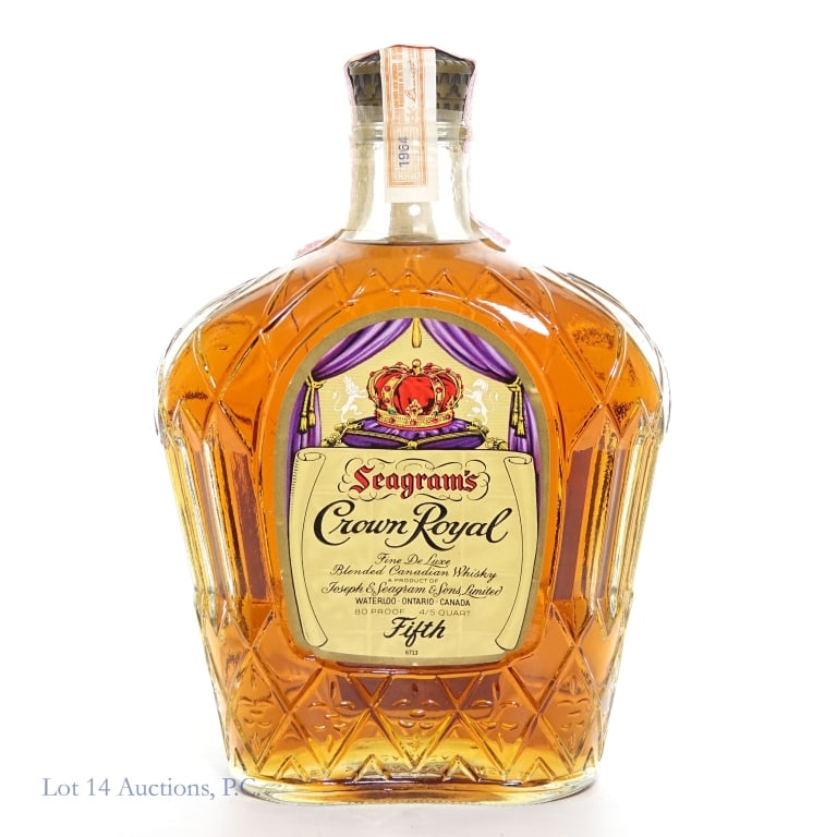 1964 Crown Royal Fine De Luxe Canadian Whisky: Crown Royal Fine De Luxe Canadian Whisky, 80 Proof, 4/5 Quart. Tax strip intact. Cello seal cracked. Purple bag and a box included.