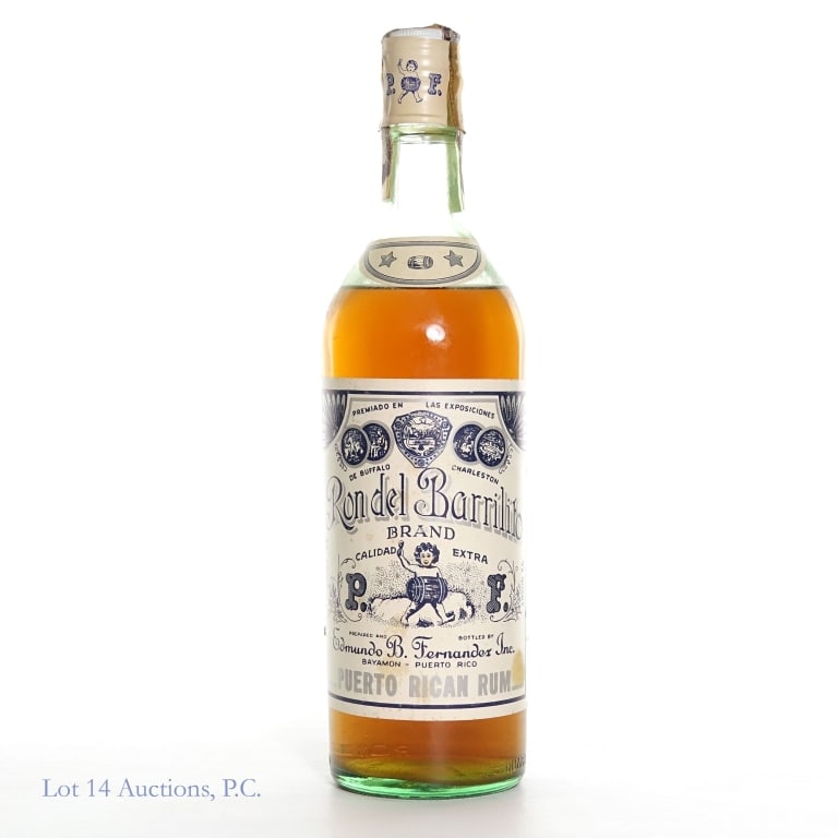 Ron Del Barrilito Calidad Extra Rum 1969*: Ron Del Barrilito Calidad Extra Puerto Rican Rum. 86 Proof, 4/5 Quart. Prepared and bottled by Edmundo B. Fernandez Inc. Bayamon - Puerto Rico. Mid shoulder fill. Vertical crack on the cello seal. Pap