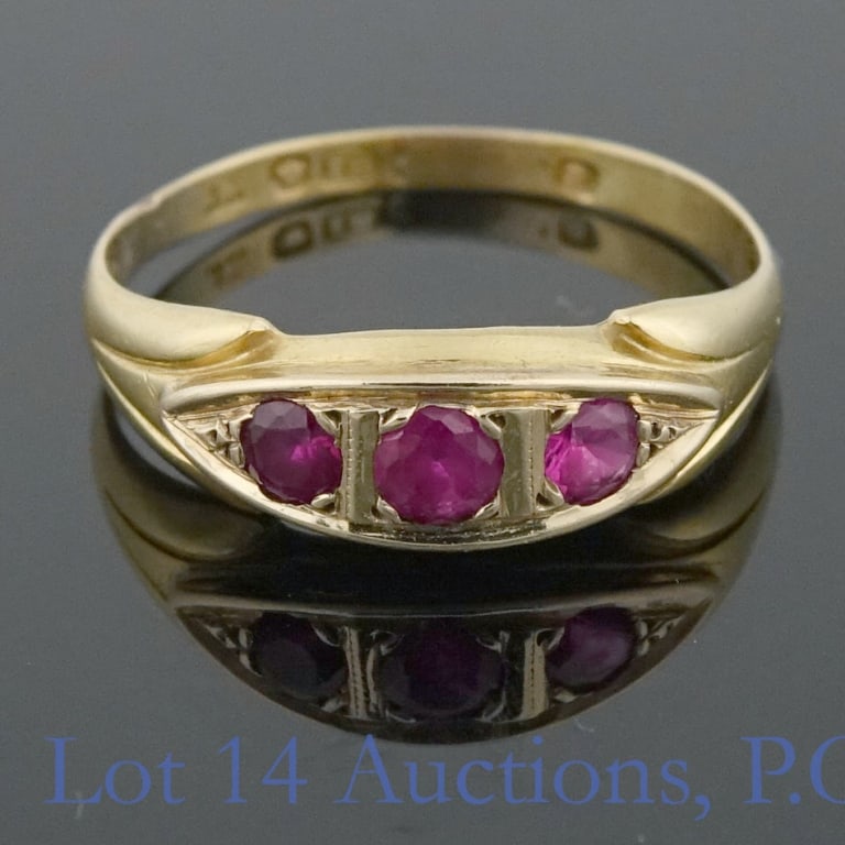 14K Y Gold Spinel Ring (UK): Yellow gold ring, marled "18K", but only tests electronically (and acid tests) as 14 karat gold (Lot 14 Auctions will guarantee 14 karat gold). Stones test electronically as spinel. Crown hallmark ind