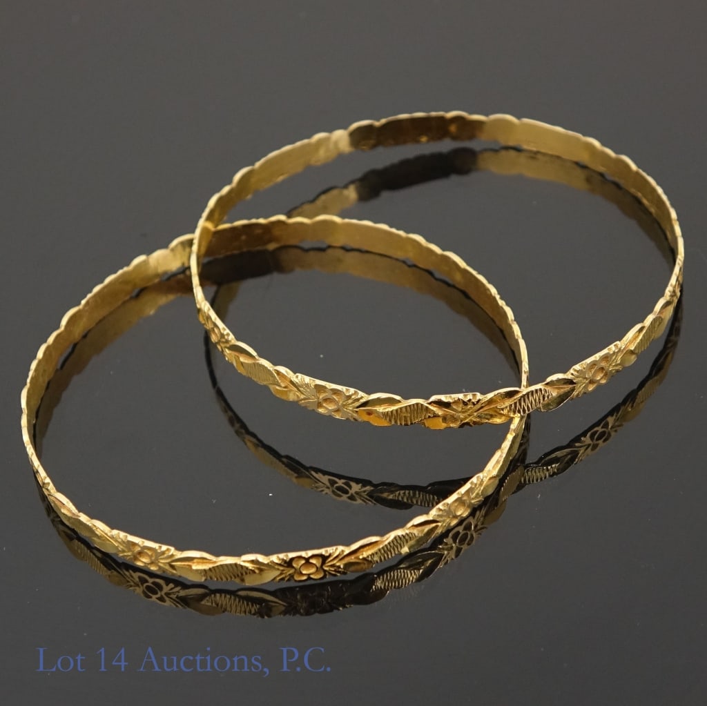 14k Yellow Gold Bracelets (2): Two (2) yellow gold bracelets. Marked "18k", but test electronically at 14 karat gold (Lot 14 Auctions will guarantee 14 karat gold). Approximately 2-5/8" diameter. Total weight for the pair: 19.95 gr