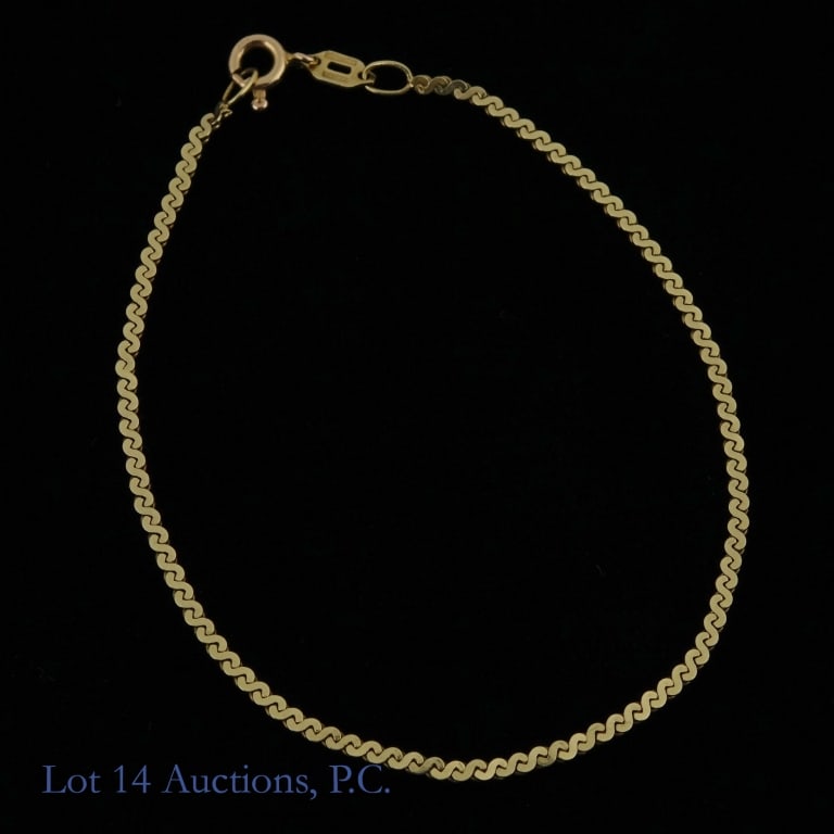 14K Y Gold Serpentine Chain Bracelet: Yellow gold serpentine chain bracelet. Marked "Italy 14KT" and tests electronically as 14 karat gold. Approximately 6.5" long. Total weight: 1.85 grams.