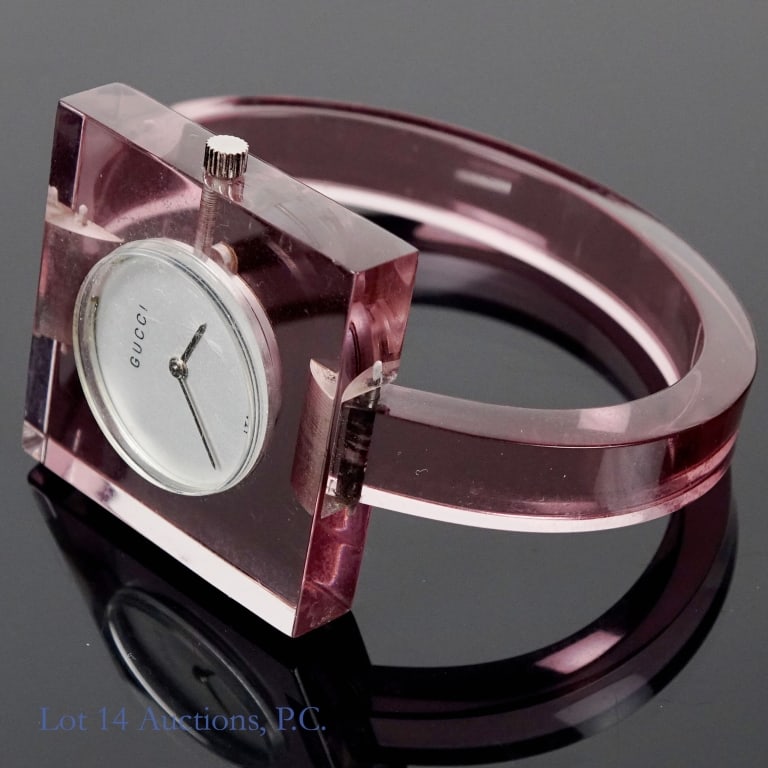 Gucci 17 Jewels Acrylic Bracelet Watch: Gucci woman's acrylic bracelet watch. 17 jewels. Runs, but untested and not serviced. . Front is 1-3/8" x 1-3/8". 2.25" inner width. Signs of wear - some scratches on back, but front has little wear.