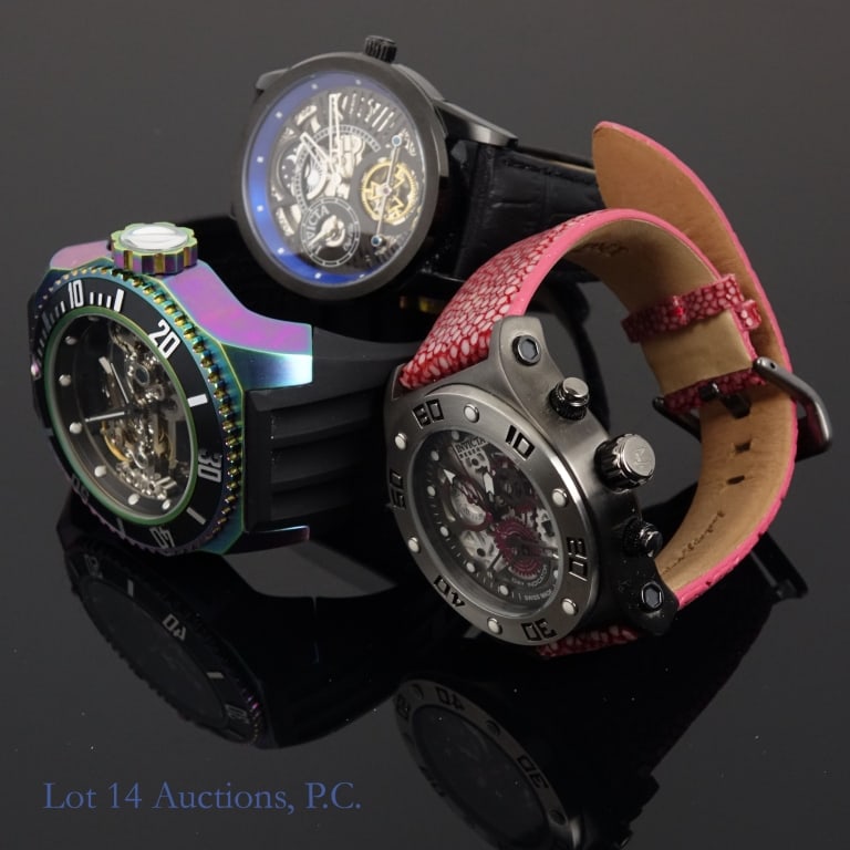 Invicta Skeleton / Gears Watches (3): Three new or very lightly used watches from Invicta with skeleton construction or gears visible. The first is an Invicta Speedway model no. 17672 in grey, white, and purple, with a stingray strap (mar