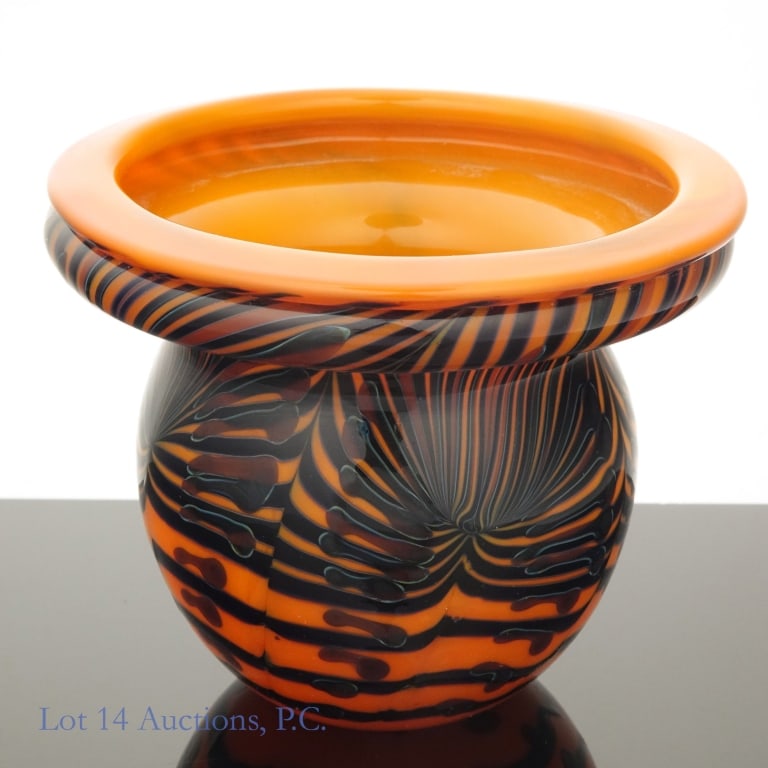 Lotton Miniature Glass Art Vase: Small piece of glass art by a member of the renowned American glass artist family, the Lottons. Small vase with a wide mouth in a black, brown, and orange chevron design. Signed "Lotton 2017" on the u
