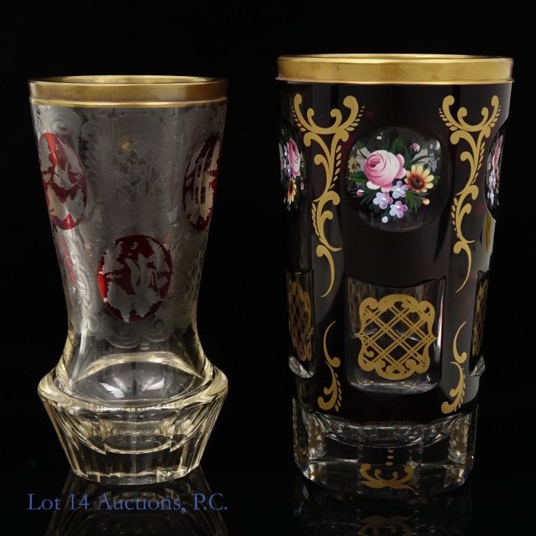 Vintage Ruby Bohemian Glass Vases (2): Two vintage Bohemian vases with hand painted enamel designs. The first is red with floral designs and, per the consignor, 24k gold accents painted on. It is approximately 5.5" tall and 3" wide. The ot