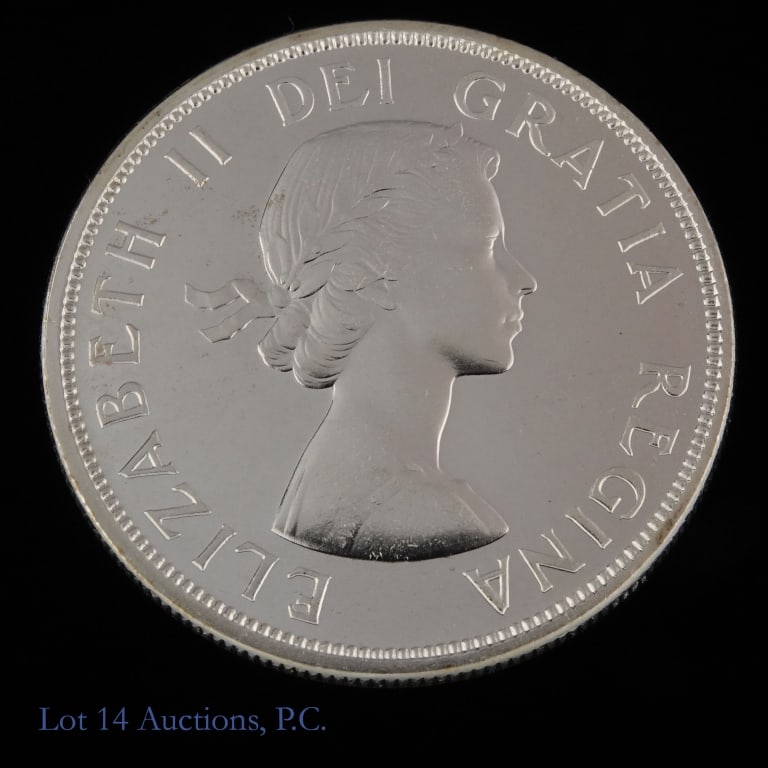 1963 Canada 80%-Silver Canoe Dollar (GEM P/L): 1963 Canada silver dollar (Royal Canadian Mint). Reverse with voyageur and an aboriginal traveling by canoe. Per consigner, has superb surfaces, virtually mark free in magnificent GEM P/L condition. M