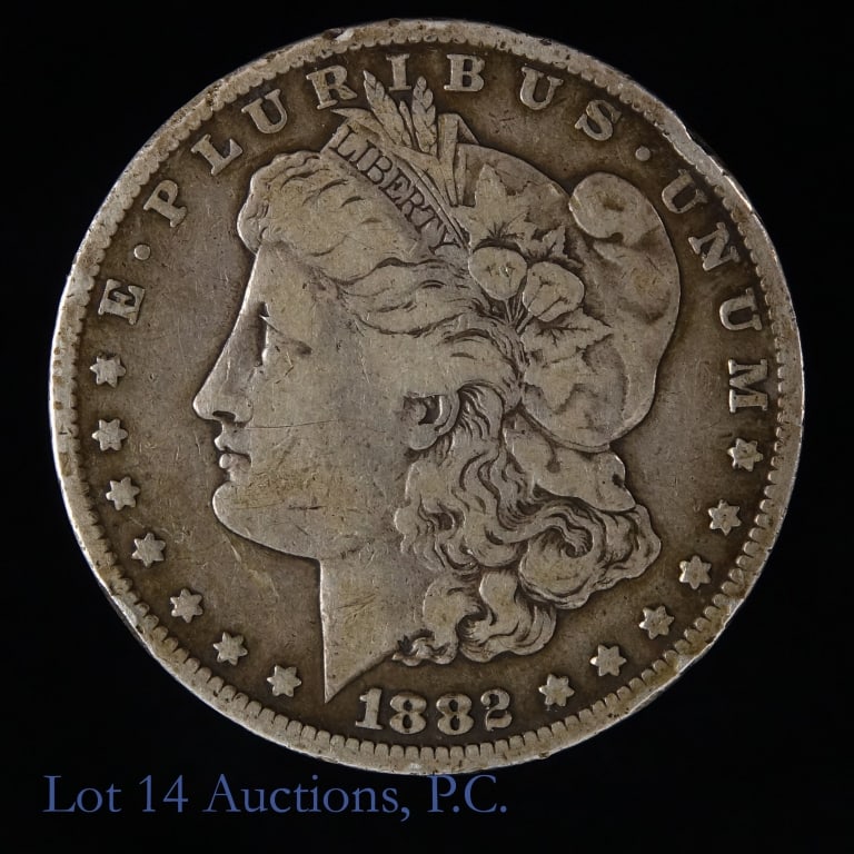 1882-CC USA Silver Morgan Dollar: 1882-CC United States silver Morgan dollar (Carson City Mint). Designer George T. Morgan. Metal is 90%-silver and weighs 26.73 grams. Metal is 90%-silver and weighs 26.73 grams. Mintage is 1,133,000. 