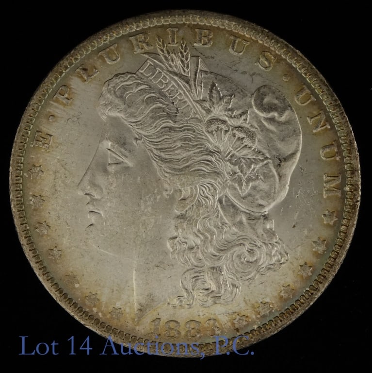 1883-O USA Silver Morgan Dollar (*MS63+): 1883-O United States silver Morgan dollar (New Orleans Mint). Designer is George T. Morgan. *Per consigner, has slight toning and grades MS-63+. Metal is 90%-silver and weighs 26.73 grams. Mintage is 