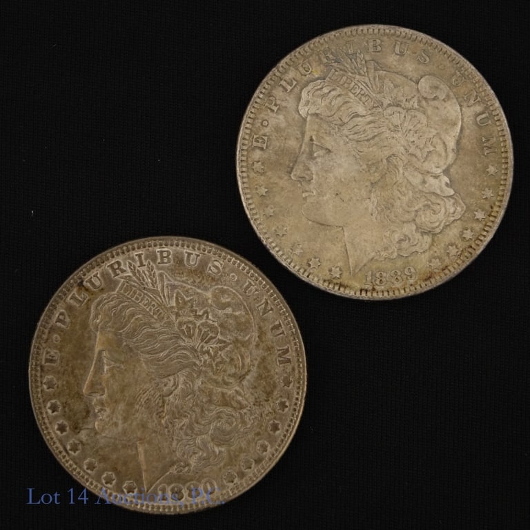 1880 & 1889 USA Silver Morgan Dollars (2): 1880 and 1889 United States 90%-silver Morgan dollars (Philadelphia Mint). ASW estimated at 1.5 troy ounces. Silver content confirmed on Lot 14 Auctions electronic metal verifier. *** Lot 14 Auctions 
