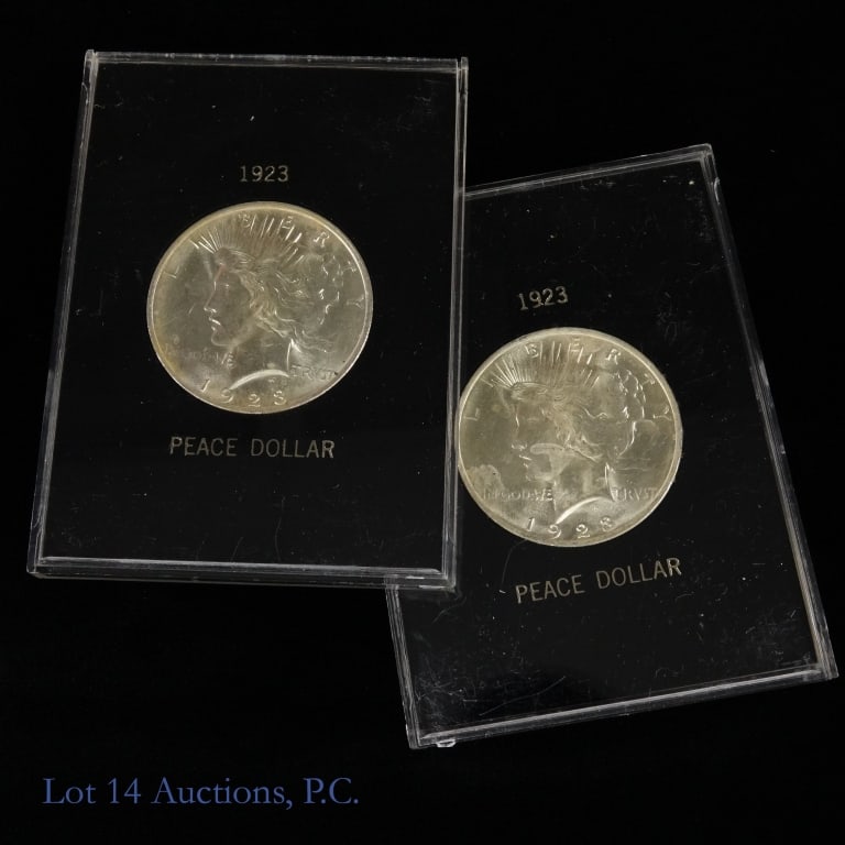 1923 USA 90%-Silver Peace Dollars (BU), 2: Two (2) United States 1923 silver peace dollars (Philadelphia Mint) in display holders. Per consigner, in BU condition. Metal is 90% silver and weighs 26.73 grams each. Silver content confirmed on Lot