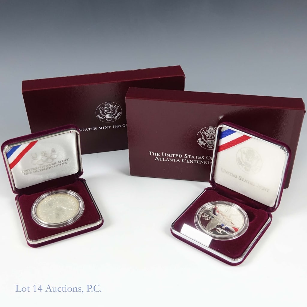 1988s & 1995 USA 90%-Silver Olympic $1 in OGP (2): Two (2) United States Mint silver Olympic commemorative dollars (Philadelphia, San Francisco Mints) with COA. Metal is 90% silver, weighs 26.73 grams, and diameter 38.1 mm each. Details as follows: --