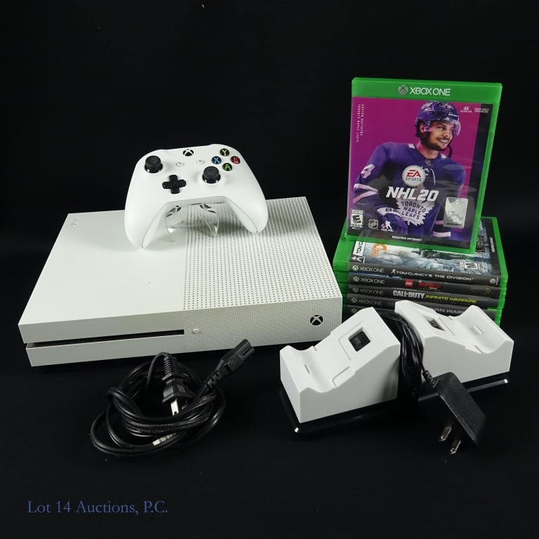 XBox One S 1TB Console, Games (6), Accessories: XBox One S 1TB console, 1 original controller, charging stand for 2 controllers and a power cord. Tested and working per consigner. Lot also includes 6 games in original cases: NHL 20, Tom Clancy's Th