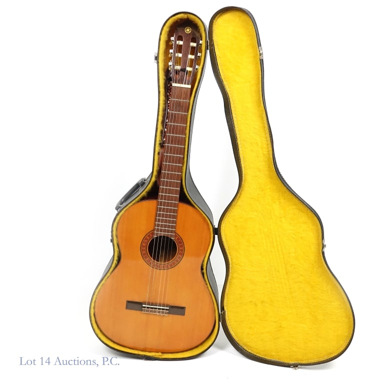 Yamaha G-60A Classical Guitar w/ Case: Yamaha G-60A Classical Guitar w/ Case. Yamaha G-60A classical guitar with lined hard case and strap. Made in Taiwan. Small scratches and scuffs on guitar - one 1" scrape on side dug into the wood. Cas