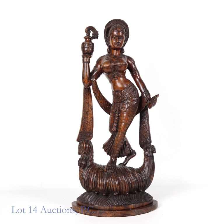 Large Wooden Statue of a Dancing Woman: Wooden statue depicting a woman standing or dancing and holding up a jar. Possibly teakwood or similar. Her left hand has fallen off and been repaired, damage is visible at the wrist. Otherwise appear