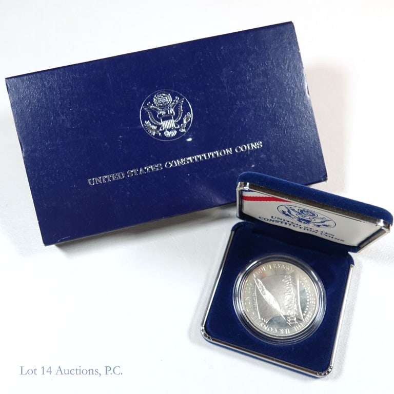 1987-S U.S. Constitution Silver Proof Dollar OGP: 1987-s United States Constitution Bicentennial commemorative silver dollar (San Francisco Mint) in OGP. Metal is 90% silver and weighs 26.73 grams. Comes in original U.S. Mint packaging with COA (some