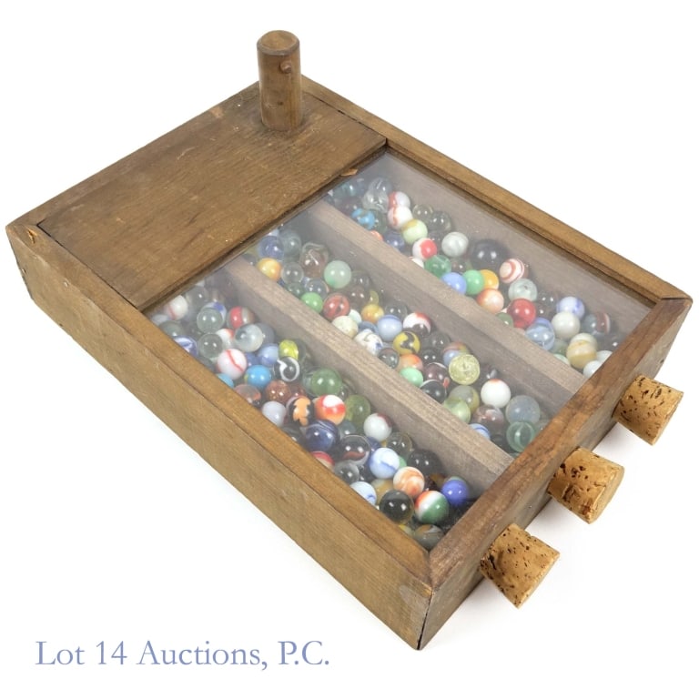 Vintage Marbles in Wood Dispenser: Lot of vintage marbles in wood dispenser. Dispenser has plexiglass panels on two sides and three cork plugs on the top. Weight including dispenser approximately 6.25". See photos for details.