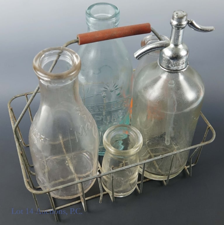 Vintage Glass Bottles - Seltzer, Milk (5): Five vintage glass bottles held in a wire basket. One is a large seltzer bottle labeled, "Island Beverage Bottling Co." "Chicago, IL" "Capacity 26 oz." and "Trade Mark". It has a slight crack near the