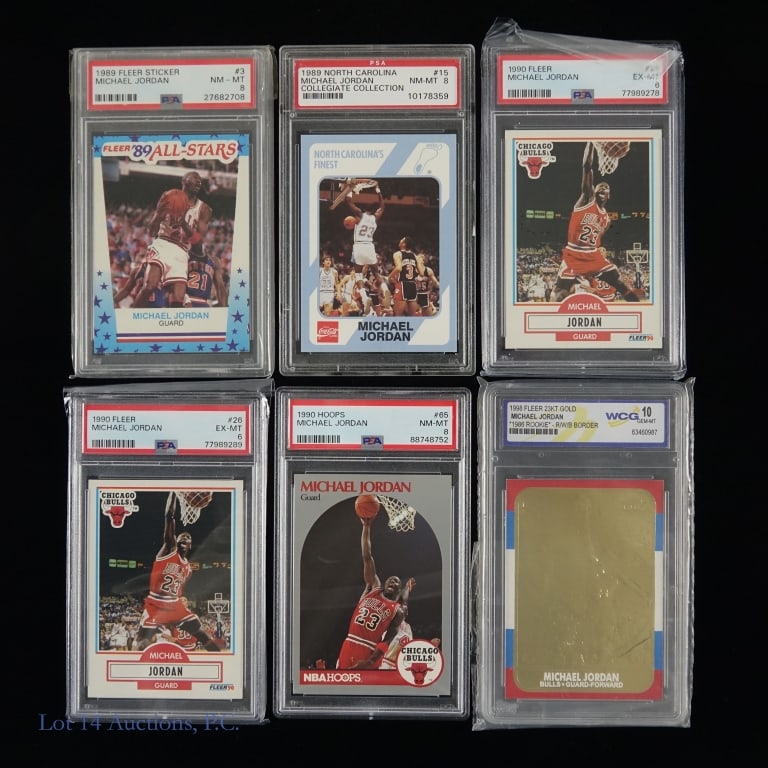 6 Graded Michael Jordan Cards: Assortment of six Michael Jordan cards that have all been graded. The cards in this lot includes 1998 Fleer 23KT Gold with a red white and blue border that has been graded 10 GEM MT by WCG***1990 Hopp