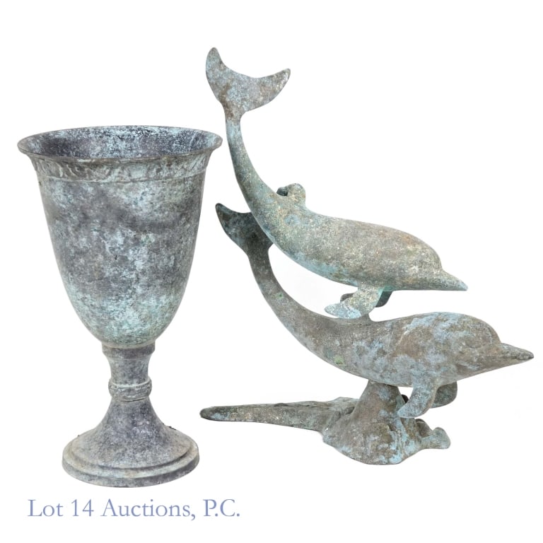 Vintage Bronze Dolphin Sculpture And Chalice: Vintage bronze sculpture depicting two dolphins, measuring approximately 15" x 14" x 7", weight approximately 6.25lbs, 0.75" crack in the base; and vintage bronze chalice / vase approximately 11.5" ta