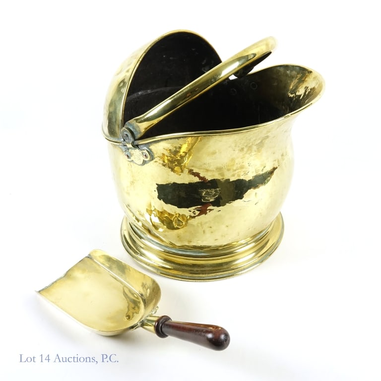 Brass Coal Scuttle and Scoop: Coal scuttle (pail / bucket) and scoop. Outer skin has a hammered texture. Approximately 12.75" tall (excluding handle). Approximately 14" from back handle to front lip. Approximately 10.75" across to