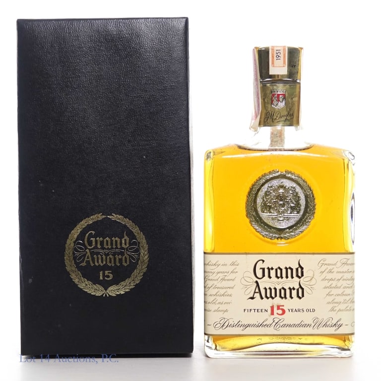1951 Grand Award Canadian Whisky: 1951 Grand Award blended Canadian whisky, 15 years old, 80 proof, 4/5 quart. Full & sealed. Bottle No. B112044. J.M. Douglas & Co. Distillers. 1951 stamped Canadian tax strip and series 112 US tax str