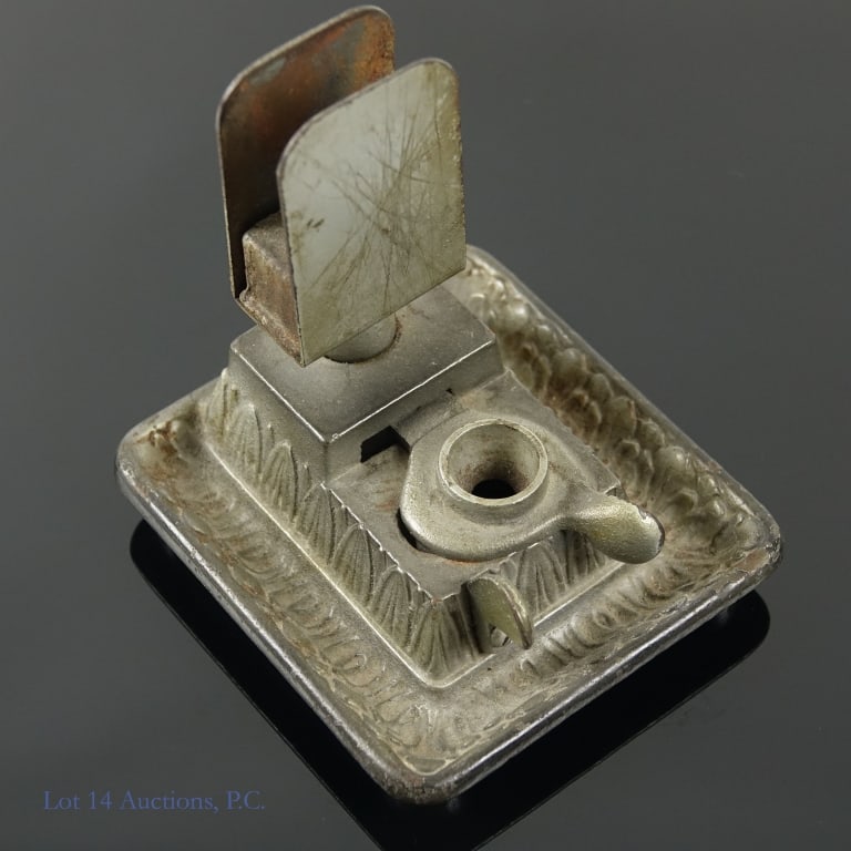 Cigar Cutter and Matchstrike, Illinois Cigar Store: Metal table top cigar cutter and match strike. Spring hinge trapdoor still operational. Approximately 3.75 x 4.25" base, 4.25" tall. This is from a Pittsville, Pike County, Illinois Cigar store which