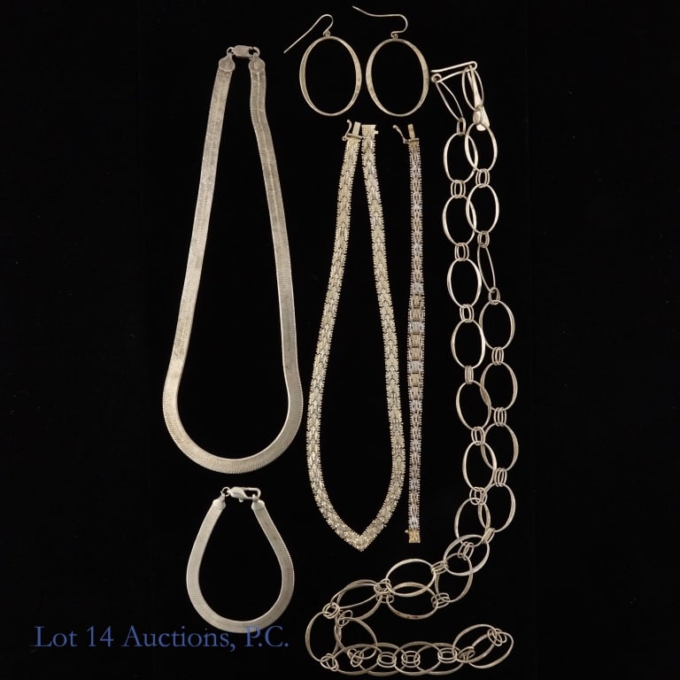 Sterling Silver Jewelry Sets (3): Three fine sterling silver jewelry sets. One is a Robert Lee Morris oval link necklace with matching earrings, one is an Italian v-neck textured necklace and matching tennis bracelet, and one is a her