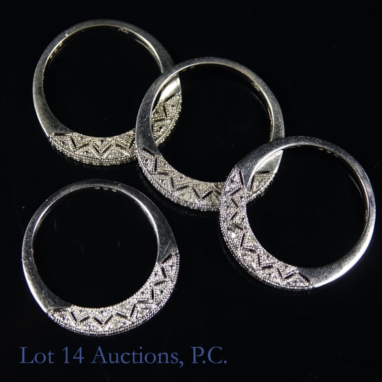 Sterling Silver and Diamond Rings (4): Four (4) sterling silver diamond rings. Size 10. Total weight approximately 0.33ozt.
