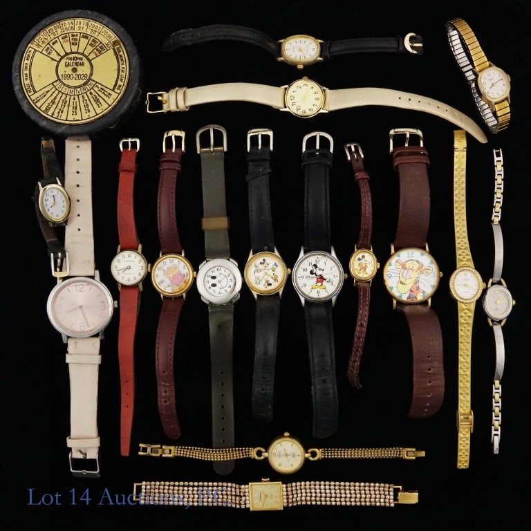 Ladies Watches Lot, Disney & More (16): Six (6) Disney wristwatches and ten (10) various other wristwatches. Lot also includes paper weight 40 years calendar. See photos for details.