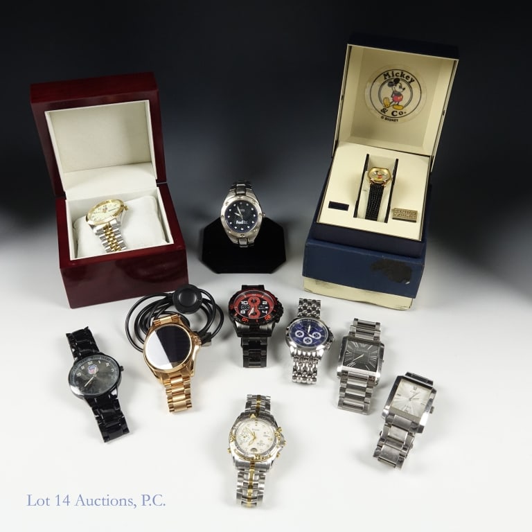 Watches Lot, Seiko, Invicta, Bulova, More (10): NOS in box women's Seiko Mickey Mouse watch ****** Nine (9) men's watches - two Invicta chronographs ****** Bulova Millenia Vibra - Alarm ****** Fossil FedEx ****** Emporio Armani ****** Guess ******