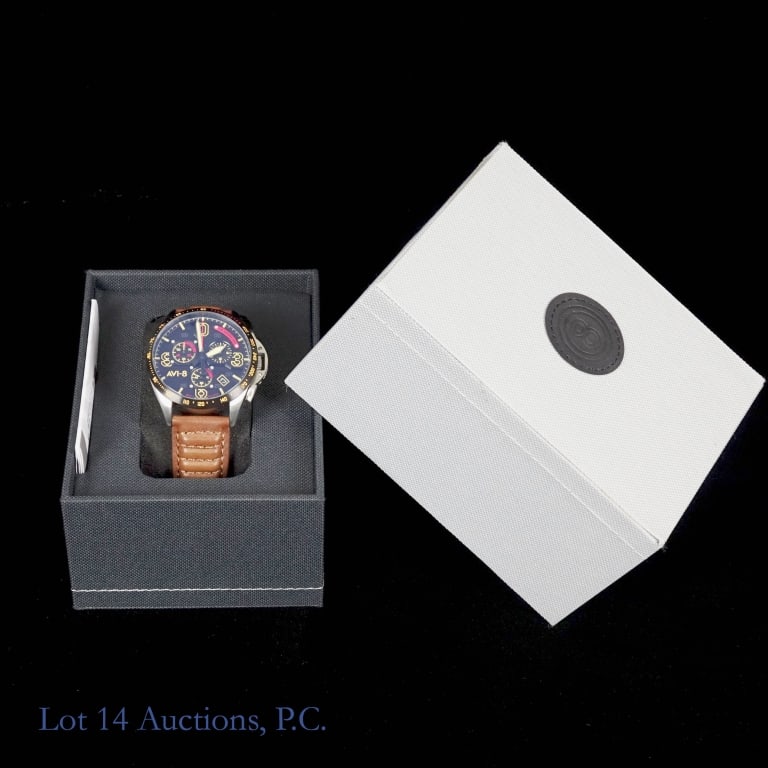 AVI-8 Mustang Blakeslee Chronograph Watch: AVI-8 P-51 Mustang Blakeslee Chronograph watch. Meca Quartz movement. Polished and brushed stainless steel case with black tachymeter bezel. Brown genuine leather band. Case diameter approximately 46.
