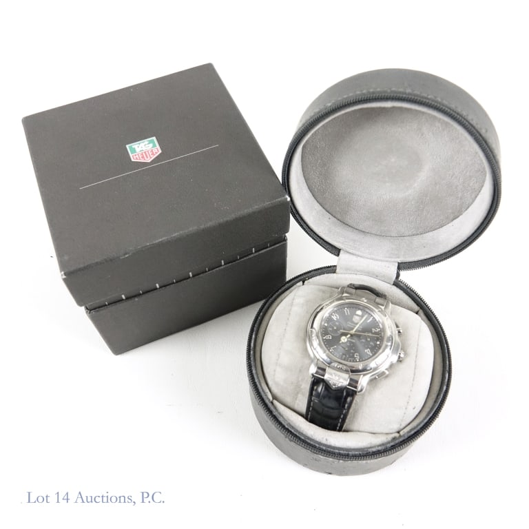 Tag Heuer CH5112 6000 Series Watch In Box: Very lightly used Tag Heuer CH5112 6000 Series watch in its original case/box. Some damage to the case and the band, but watch itself is in fairly good condition. Spare leather band included. Running,