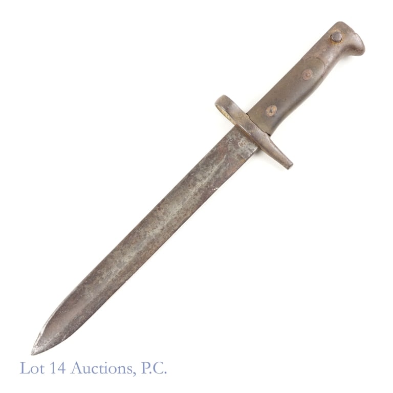 Italian Model 1870 Bayonet: Italy - model 1870 bayonet. Blade: 9.5". Overall length: 14.5". Press stud moves easily. Oxidation on blade. One side of the ricasso is stamped with the letters "TA" below a crown (we believe this is