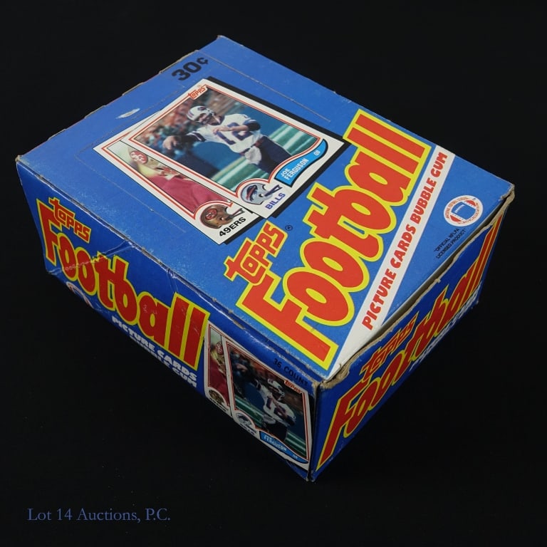 1982 Topps Football Cards Wax Box: 1982 Topps NFL Football cards wax box. Inside, 36 sealed wax packs, each with 15 football trading cards and a stick of bubble gum. The box has some wear. Key cards which may be present include #443 (L
