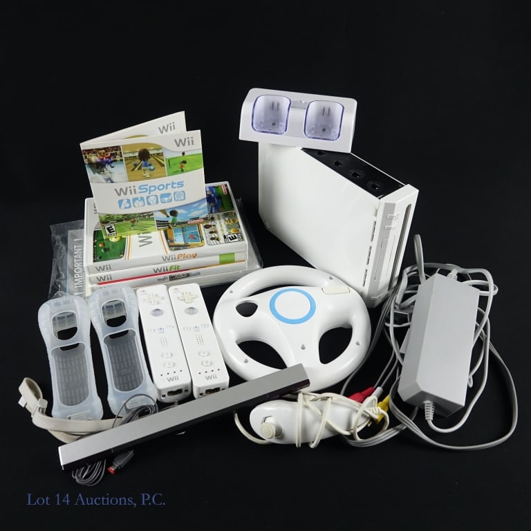 Nintendo Wii Console & Games (4): Nintendo Wii console with manuals, power adapter, video cable, 2 Wiimote controllers, 1 Nunchuck controller, 2 controller charging stand, steering wheel and 4 games: Margot's Word Brain, Wii Fit, Wii