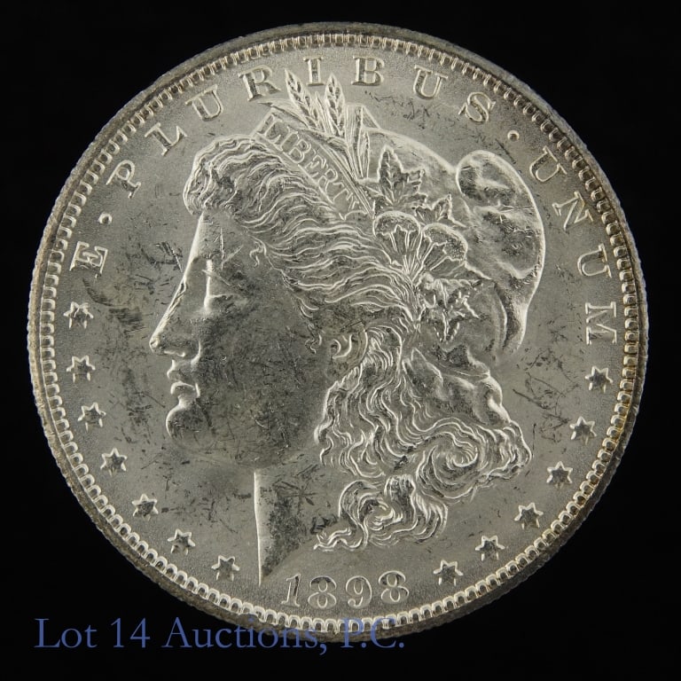 1898-O USA Silver Morgan Dollar (CH BU): 1898-O United States silver Morgan dollar (New Orleans Mint). Designer is George T. Morgan. Per consigner, in CH BU condition. Mintage 4,440,000. Silver content confirmed on Lot 14 Auctions electronic