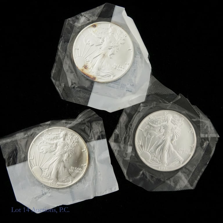 1989, 1990 & 1991 American 99.9% Silver Eagles, 3: Three (3) American silver eagle uncirculated dollar bullion coins in Littleton Coin Company holder. Dates as follows: ---1989, 1990 and 1991. Metal 99.9% silver, weighs 31.103 grams (1 troy ounce), an