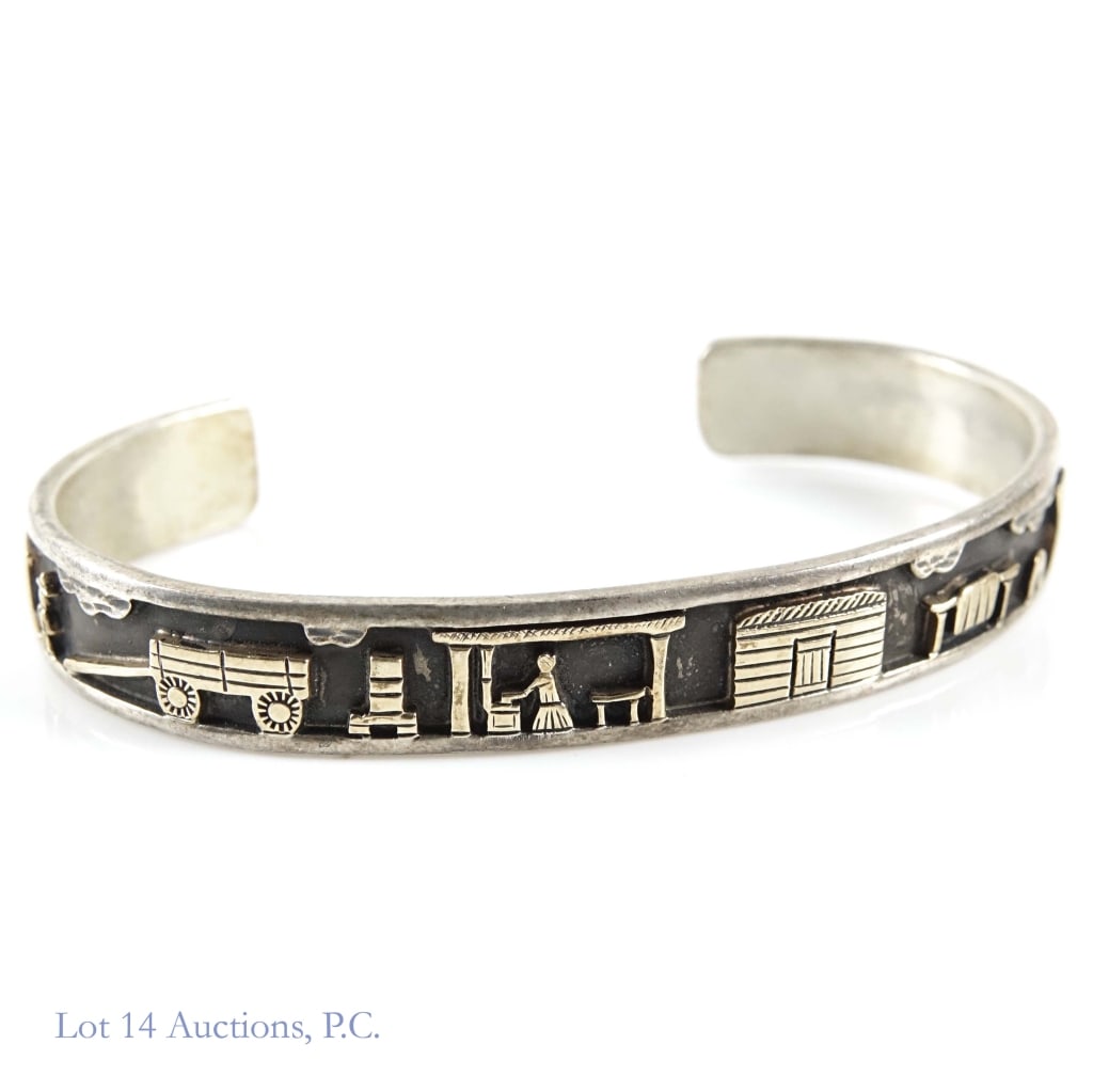 RH Begay Sterling & 14k Gold Storyteller Bracelet: Navajo storyteller bracelet by famous indigenous silversmith and artist Roland Hogan Begay. The bracelet itself is made of sterling silver, and the actual storytelling decor is made with 14k gold, bot