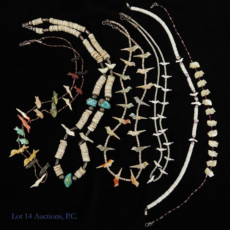 Vintage Handmade Zuni Fetish Necklaces: Six handmade vintage Zuni fetish necklaces decorated with various carved animal beads. Some appear to have sterling fastenings. From shortest to longest; a 16" cord with white shells, four carved bird
