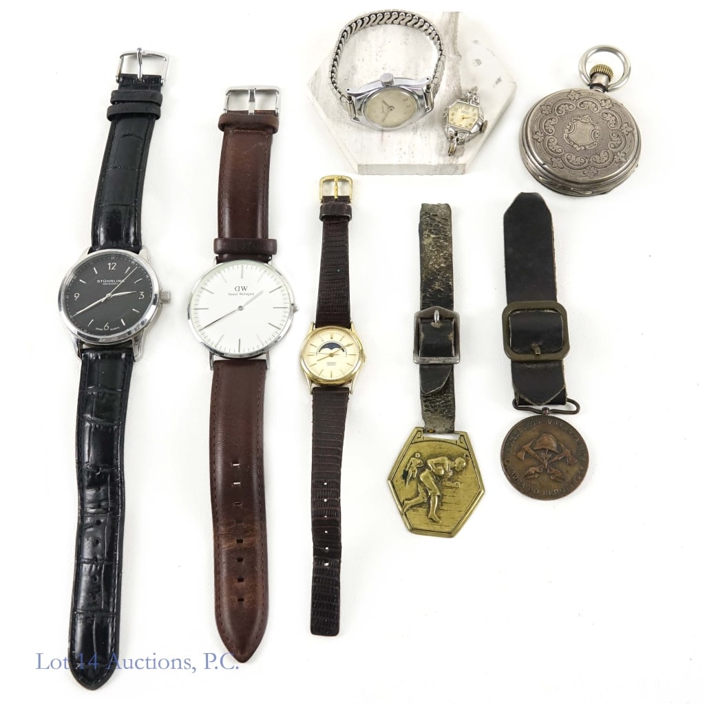 Vintage Watches & Watch Fobs: Lot includes five vintage watches, one vintage pocket watch, and two vintage watch fobs. The first watch is a Stuhrling Original Symphony watch with a black leather strap. Watch is in good condition, 