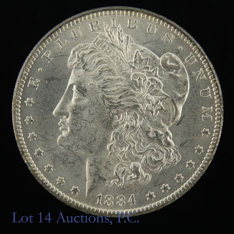 1884-O USA Silver Morgan Dollar: 1884-O United States silver Morgan dollar (New Orleans Mint). Designer is George T. Morgan. Per consigner, in CH BU P/L condition. Mintage 9,730,000. Silver content confirmed on Lot 14 Auctions electr