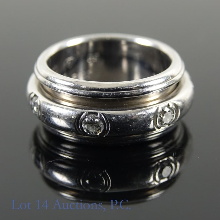 18k W Gold Piaget Possession Ring w/ Diamonds Sz.9: A size 9 ring made with 18k white gold from Piaget's "Possession" line. Marked 750 on the inside. In original packaging, COA is present. Ring weighs approximately 21.06g.