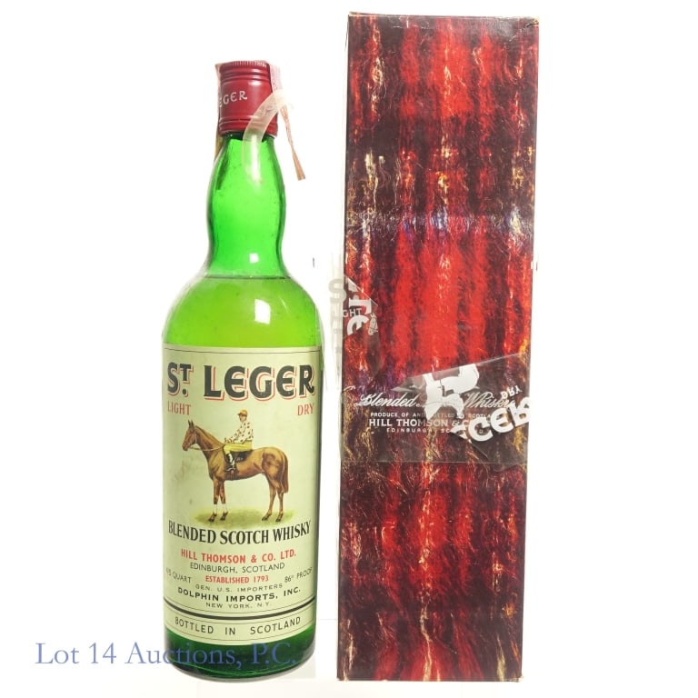 1960s / 1970s St. Leger Blended Scotch Whisky: 60s/70s St. Leger Blended Scotch Whisky in original box. Tax strip is fully intact but separated from the bottle on one side. Capsule is fully intact. 86 Proof, 4/5 Quart.